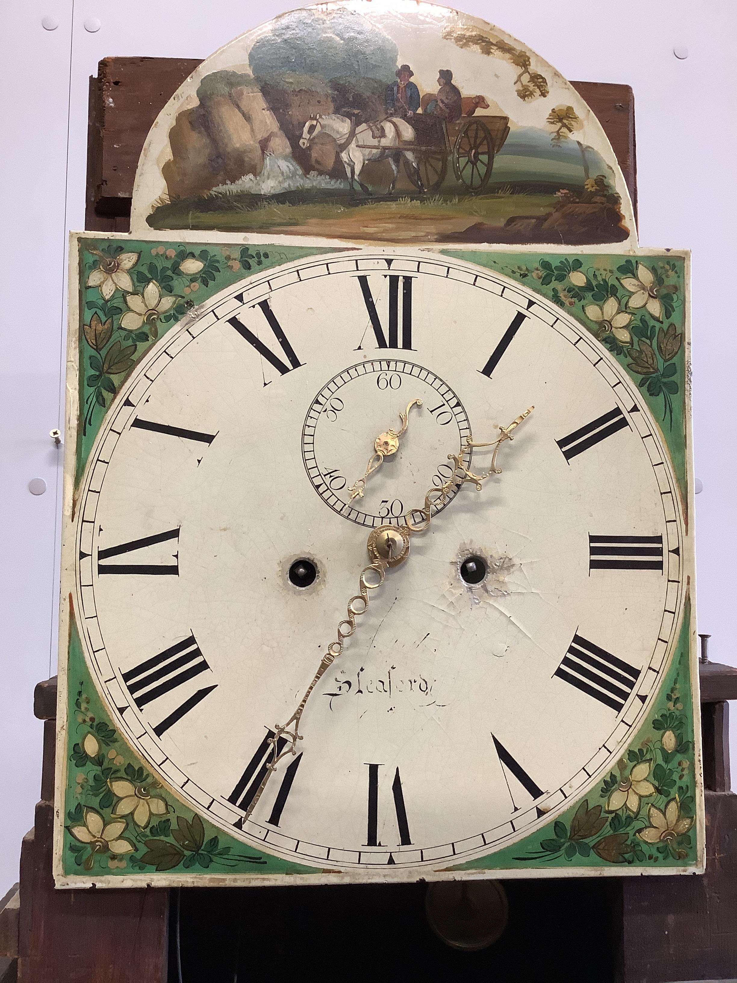An early 19th century oak and mahogany eight day longcase clock, the painted dial marked Sleaford, height 222cm